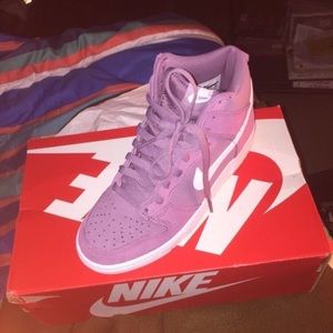 Purple and white Nikes 5.5
